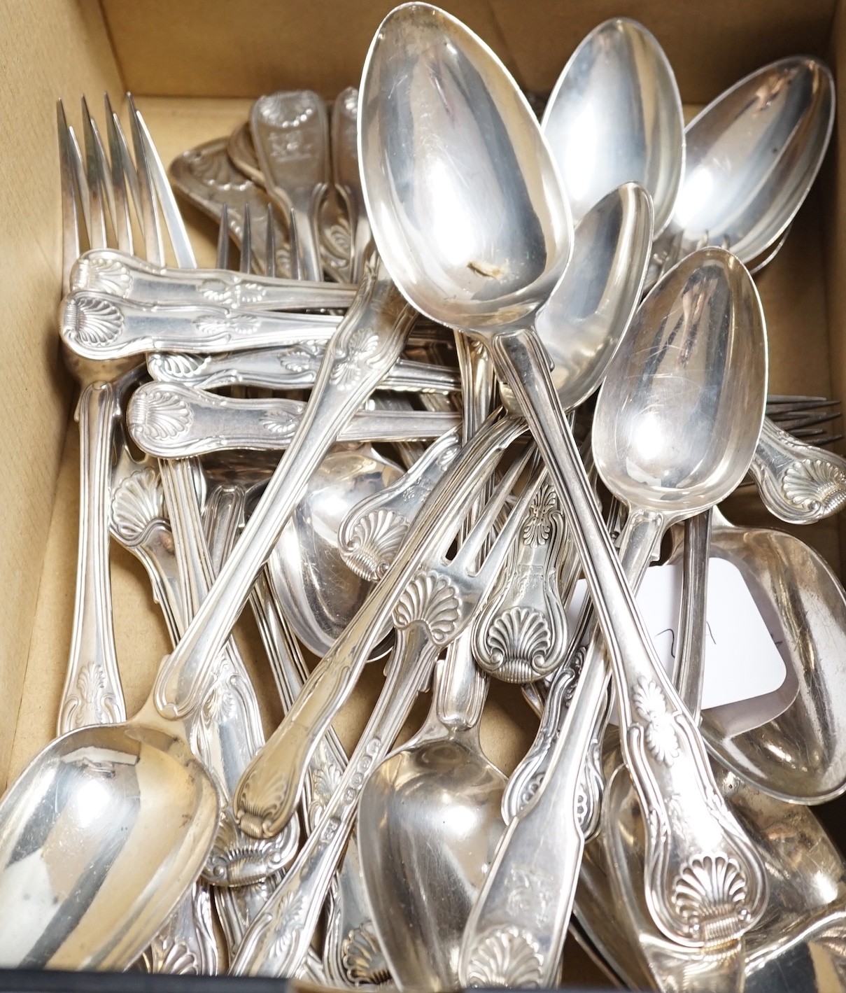 A harlequin part canteen of 19th century silver Kings pattern flatware include a pair of basting spoons, Robert Rutland, London, 1825, three dessert spoons, five serving spoons, six dinner forks and eight dessert forks,